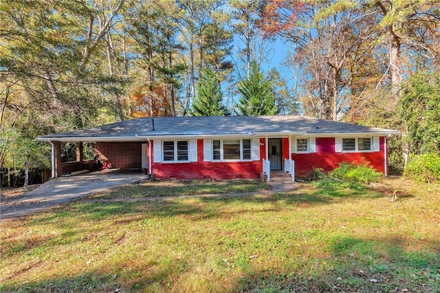 single story home with a front yard and a carport