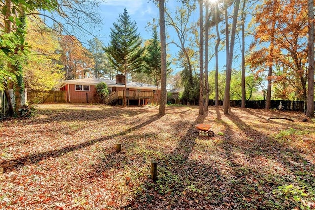 view of yard with a wooden deck