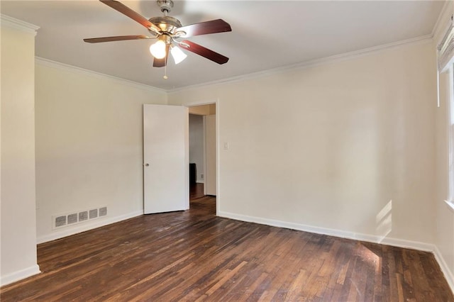 spare room with ornamental molding, ceiling fan, and dark hardwood / wood-style floors