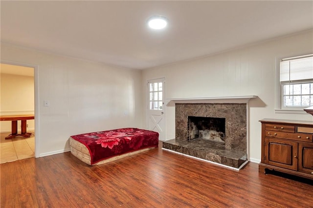 bedroom with multiple windows and wood-type flooring