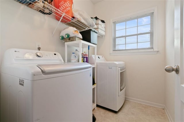 829 Castlebottom Dr, Lawrenceville, GA 30045 - laundry area with independent washer and dryer, baseboards, and light tile patterned floors