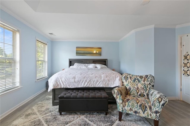 829 Castlebottom Dr, Lawrenceville, GA 30045 - bedroom featuring wood finished floors, baseboards, and ornamental molding