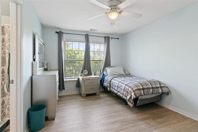 829 Castlebottom Dr, Lawrenceville, GA 30045 - bedroom with light wood-style floors, baseboards, and ceiling fan