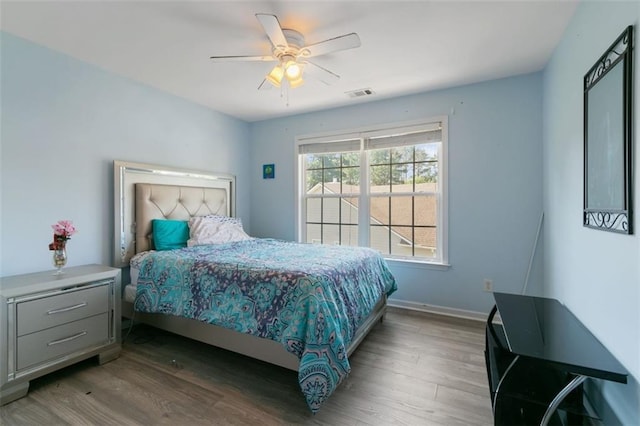829 Castlebottom Dr, Lawrenceville, GA 30045 - bedroom with wood finished floors, ceiling fan, and baseboards