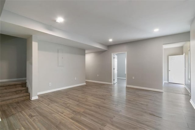 829 Castlebottom Dr, Lawrenceville, GA 30045 - finished below grade area featuring baseboards, recessed lighting, wood finished floors, and stairway