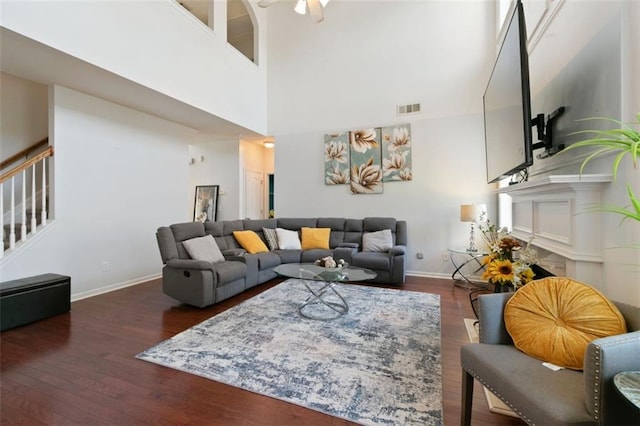 829 Castlebottom Dr, Lawrenceville, GA 30045 - living area with stairway, baseboards, dark wood-type flooring, a high ceiling, and a ceiling fan