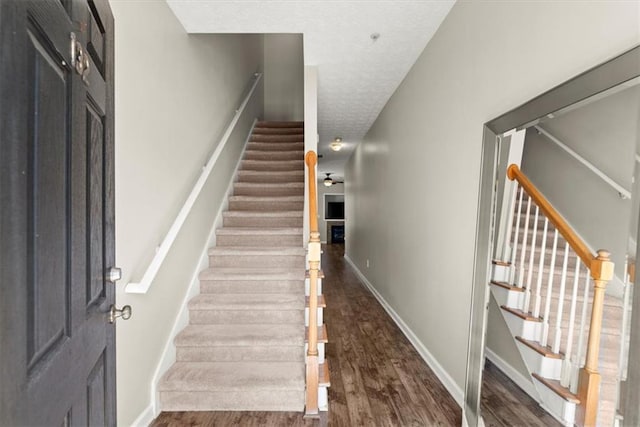 stairway featuring hardwood / wood-style flooring