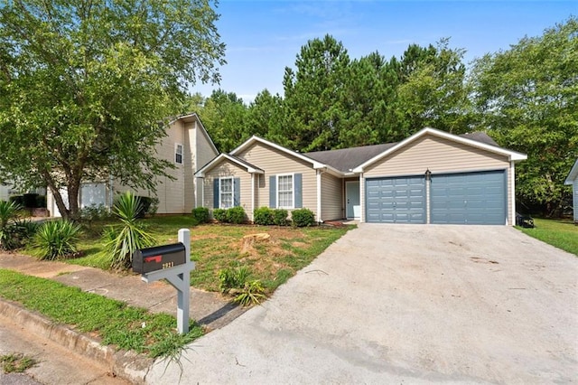 single story home with a front yard and a garage