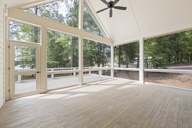 unfurnished sunroom with lofted ceiling and ceiling fan