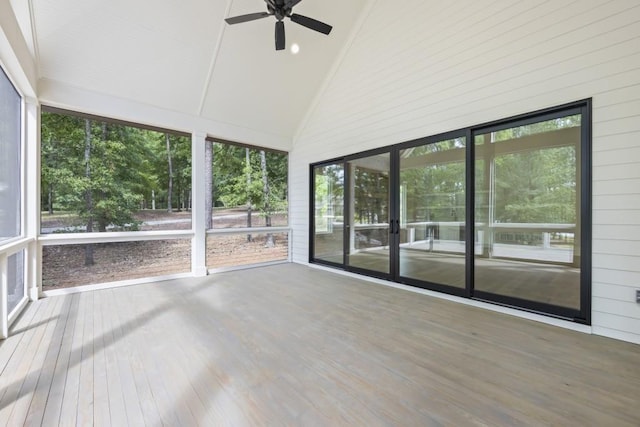 unfurnished sunroom with lofted ceiling and ceiling fan