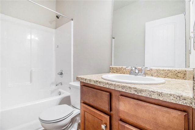 bathroom featuring shower / bathing tub combination, toilet, and vanity