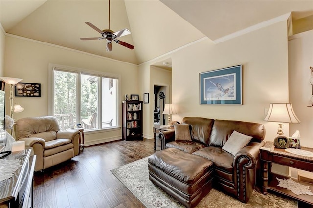 living room featuring ceiling fan, dark hardwood / wood-style floors, ornamental molding, and vaulted ceiling