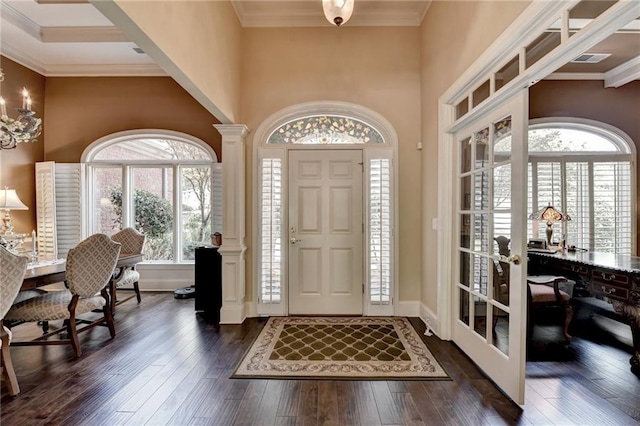 foyer with crown molding and dark wood-type flooring