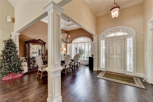 entrance foyer featuring a healthy amount of sunlight, a high ceiling, and a chandelier