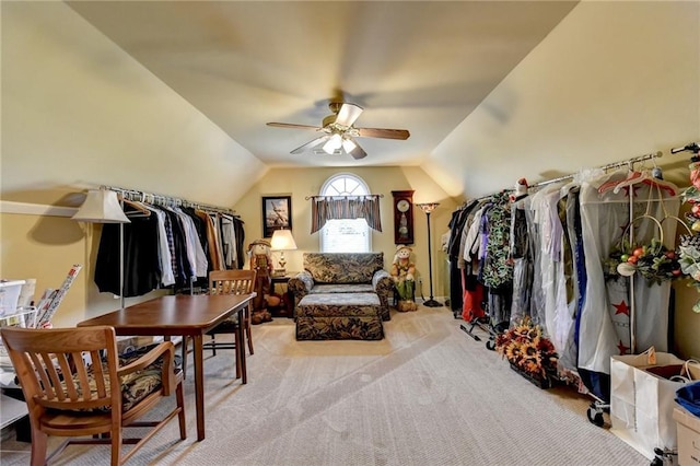 interior space with ceiling fan, light carpet, and lofted ceiling