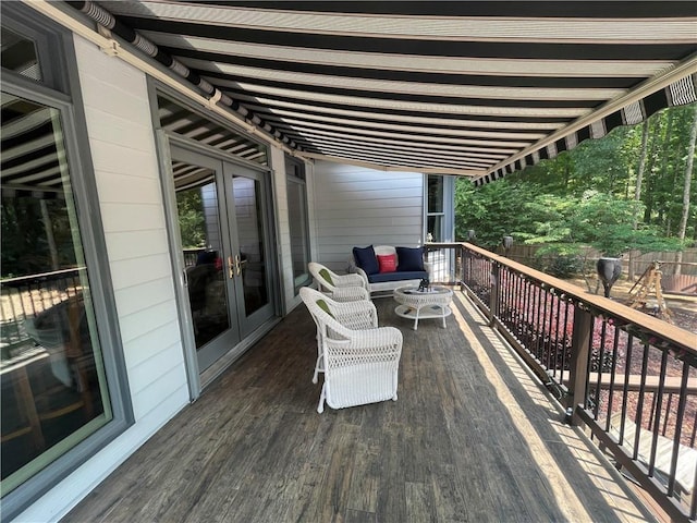 wooden deck featuring french doors