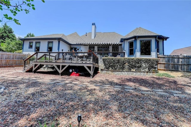 rear view of house with a wooden deck