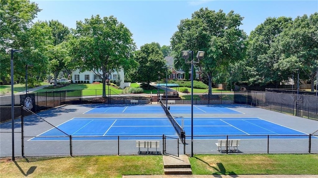 view of sport court with a yard and basketball court