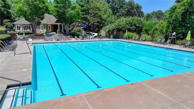 view of swimming pool featuring a patio area