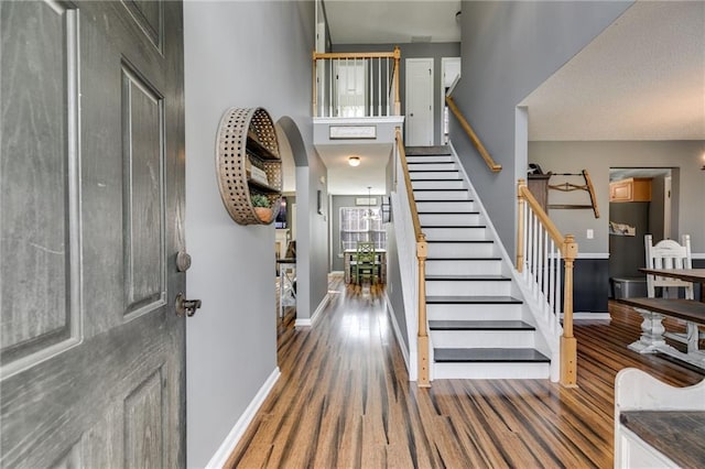 foyer entrance featuring dark hardwood / wood-style floors