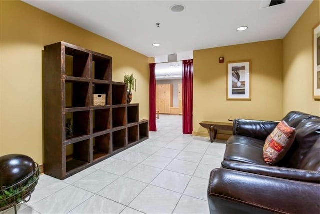 living room with light tile patterned flooring and recessed lighting