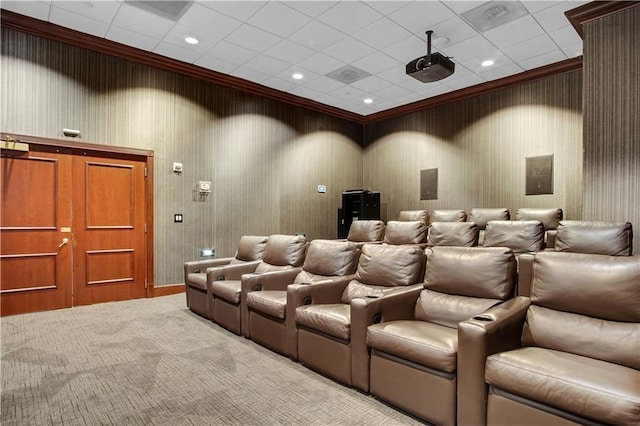 home theater room with light carpet, ornamental molding, and recessed lighting