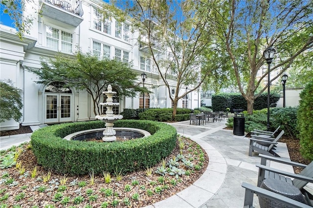 view of property's community featuring a patio area