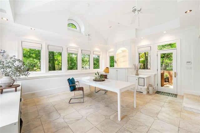 sunroom featuring lofted ceiling and plenty of natural light