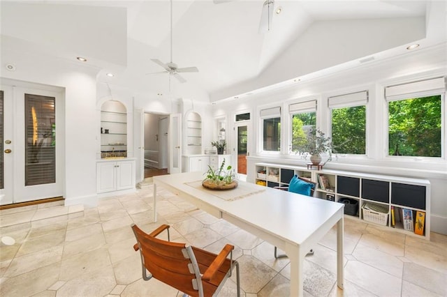 dining room featuring built in shelves, ceiling fan, high vaulted ceiling, and recessed lighting