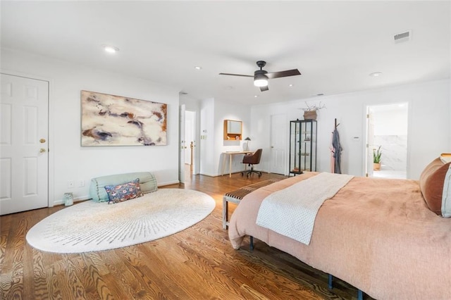 bedroom with wood finished floors, baseboards, recessed lighting, and ceiling fan