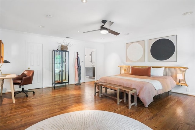 bedroom with wood finished floors and recessed lighting