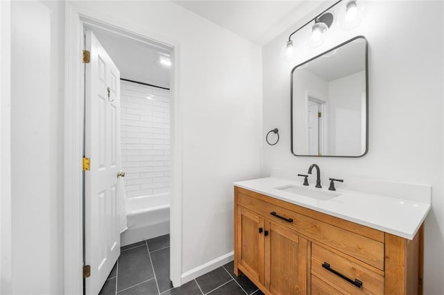 full bath with tile patterned flooring, vanity, baseboards, and  shower combination