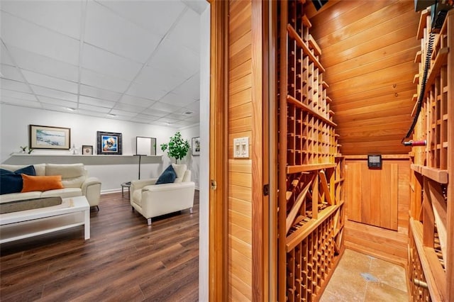 wine area featuring wood finished floors and baseboards