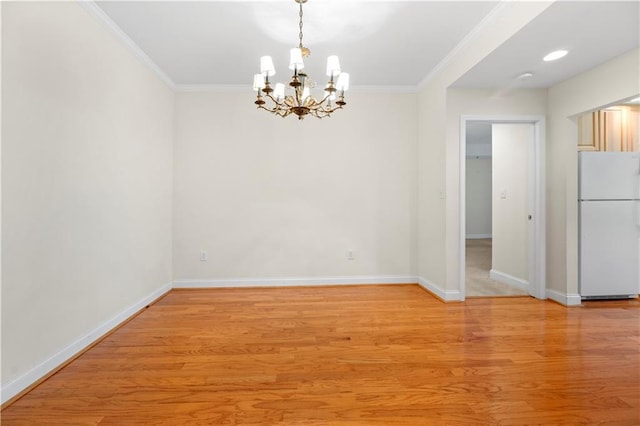 50 Biscayne Dr NW Unit 2113, Atlanta, GA 30309 - unfurnished room with a chandelier, ornamental molding, and light wood-type flooring