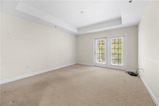 50 Biscayne Dr NW Unit 2113, Atlanta, GA 30309 - unfurnished room featuring a tray ceiling and light colored carpet