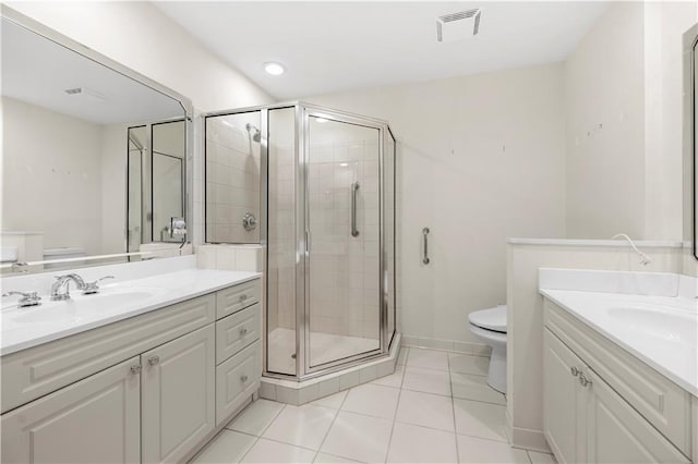 50 Biscayne Dr NW Unit 2113, Atlanta, GA 30309 - bathroom featuring two vanities, a shower stall, and tile patterned floors
