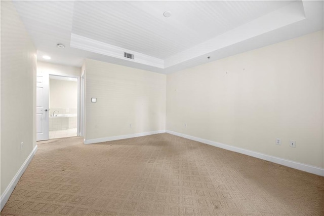 50 Biscayne Dr NW Unit 2113, Atlanta, GA 30309 - unfurnished room with a raised ceiling, light carpet, and recessed lighting