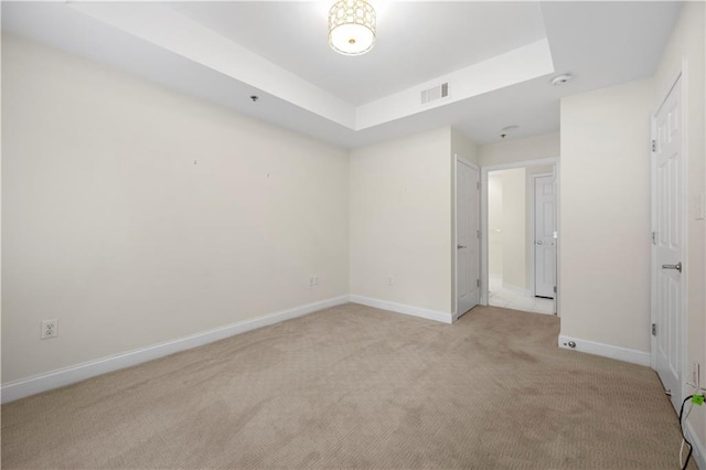 50 Biscayne Dr NW Unit 2113, Atlanta, GA 30309 - unfurnished bedroom with light colored carpet and a tray ceiling