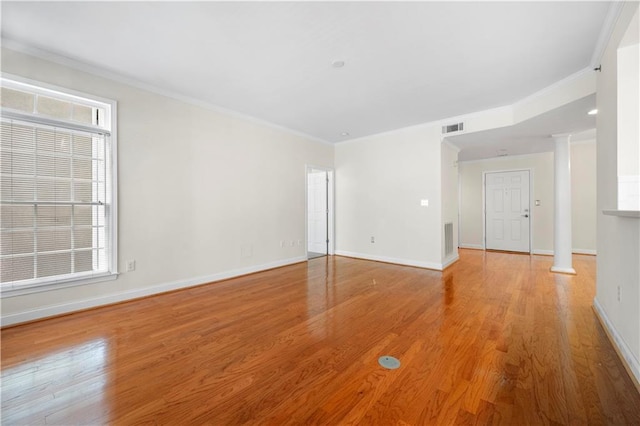 50 Biscayne Dr NW Unit 2113, Atlanta, GA 30309 - empty room featuring ornate columns, light wood-type flooring, and crown molding