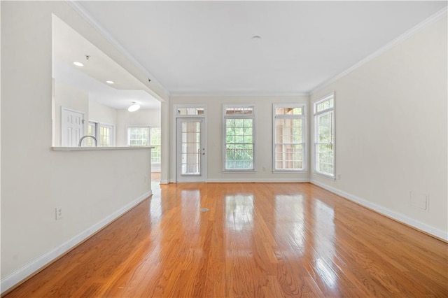 50 Biscayne Dr NW Unit 2113, Atlanta, GA 30309 - unfurnished living room with healthy amount of natural light, light wood finished floors, and ornamental molding