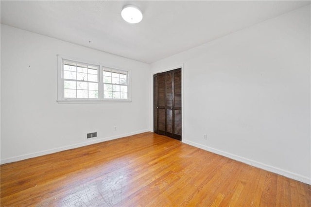 unfurnished room featuring light wood-type flooring