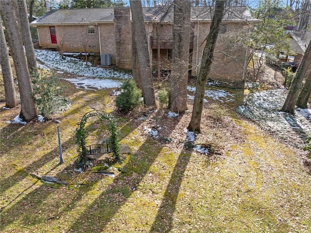 view of yard featuring central AC and a water view