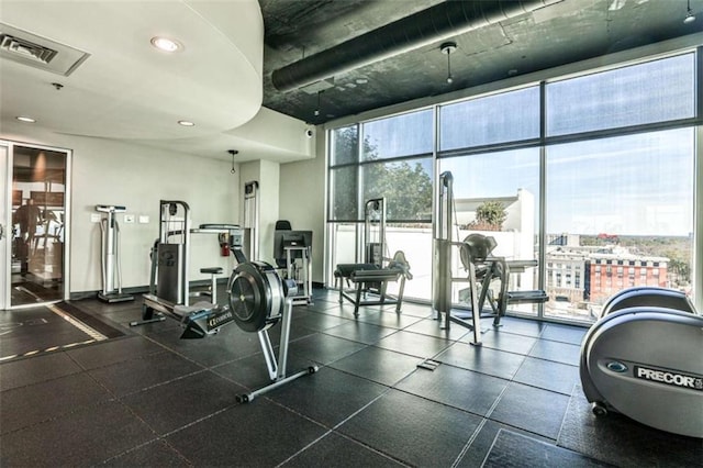 exercise room featuring expansive windows