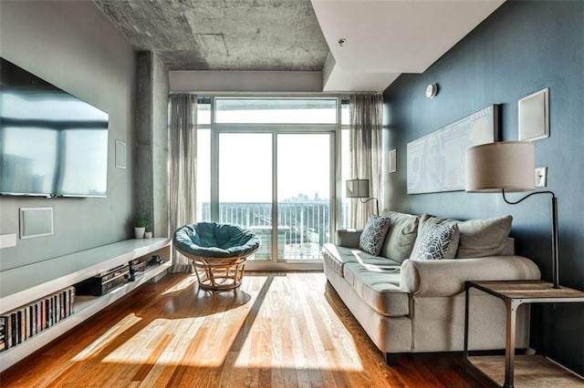 sitting room with wood-type flooring