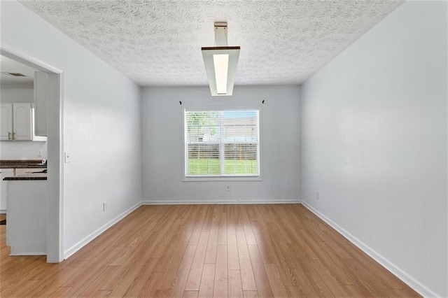 150 Crestworth Xing, Powder Springs, GA 30127 - empty room with light wood-type flooring and a textured ceiling