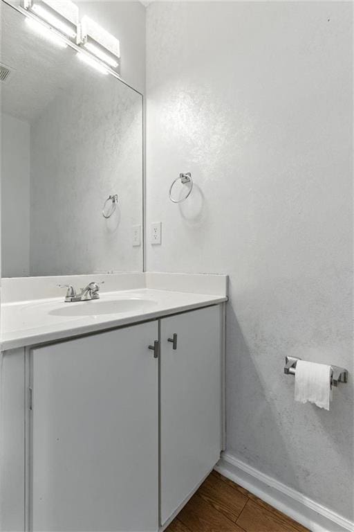 150 Crestworth Xing, Powder Springs, GA 30127 - bathroom featuring vanity and wood finished floors