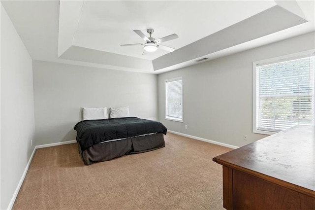 150 Crestworth Xing, Powder Springs, GA 30127 - bedroom featuring a tray ceiling, light colored carpet, and ceiling fan