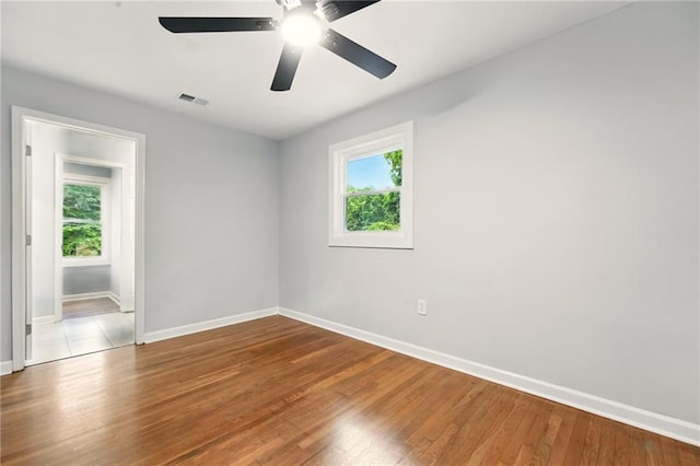 163 Oakcliff Ct, South Fulton, GA 30331 - unfurnished room with plenty of natural light, baseboards, wood finished floors, and ceiling fan