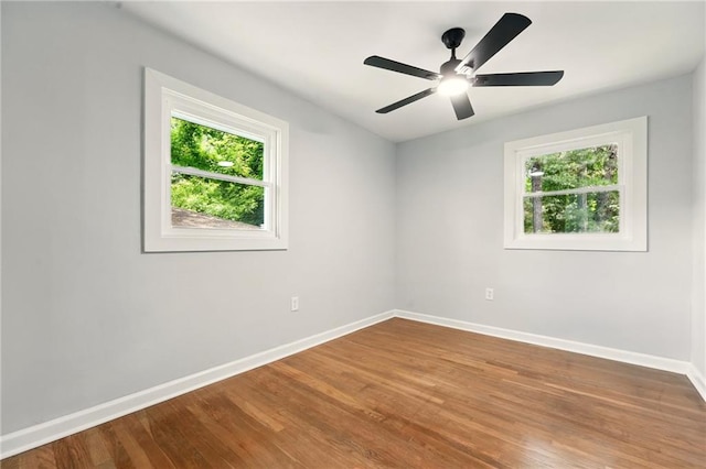 163 Oakcliff Ct, South Fulton, GA 30331 - empty room featuring plenty of natural light, baseboards, and wood finished floors