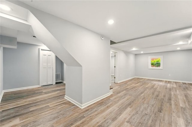 163 Oakcliff Ct, South Fulton, GA 30331 - below grade area with light wood finished floors, baseboards, and recessed lighting